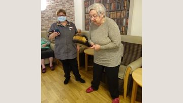 Competitive pancake tossing at Lincolnshire care home